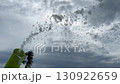 Slow motion where white foam flies out onto the playground to celebrate. Foam cannon on the background of the sky with clouds. High quality FullHD footage 130922659
