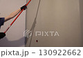 The man is a professional who paints the wall white with a paint roller. Apartment painting, renovation. With space to copy. High quality 4k footage 130922662