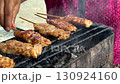 Close-up of Thai food, BBQ pork skewers on a charcoal stove in Thailand street food. 130924160
