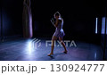 Handheld, kickboxing camera shaking, woman pro fighter trains his beats, hard training in the boxing gym, sporty woman trains a series of punches. 130924777