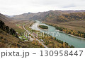Panoramic view of the Katun River with azure water and an island in the middle of the river. Altai Mountains in autumn. Amazing beautiful view of Altai mountains and turquoise mountain river Katun 130958447