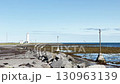 Calm view of a lighthouse at a Iceland coast, beautiful view of the sea and clear horizon, first-person view, UGC, Seascape Iceland landscape. 130963139