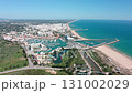 Beautiful aerial view of vilamoura, a popular tourist destination in the algarve region of portugal, highlighting the marina, beach, urban development, and surrounding landscape 131002029