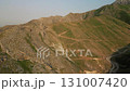 Morning light on Baysuntau ridges and winding road near Boysun, Uzbekistan 131007420