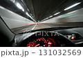 Dynamic Perspectives Driving Through a Contemporary, Modern Tunnel in an Urban Environment at Night 131032569