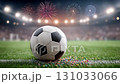 An Exciting Soccer Ball on the Field with Colorful Fireworks Illuminating the Stadium Atmosphere Effectively 131033066