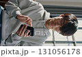 Vertical loop video of a young man's everyday life using a smartphone 131056178