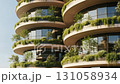 Modern sustainable architecture with curved balconies and vertical gardens 131058934