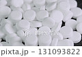 White round pills and drugs rotating macro top view. Modern science and technology. Pharmaceutical production 131093822