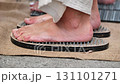 Sadhu standing on nail board practicing yoga in India 131101271