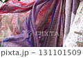 Colorful indian fabrics waving in the wind in a street market in India 131101509