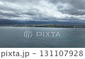9月中旬の富山県下新川海岸と黒部川扇状地を背に回転する洋上風力発電風車 131107928
