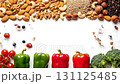 Healthy eating and diet concept. Stop motion of berries and almonds forming the word HEALTH. Vegetables and nuts create a border on a white background. Healthy eating and diet concept. Stop motion of berries and almonds forming the word HEALTH. Vegetables and nuts create a border on a white background. 131125485