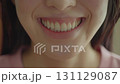 Smiling Woman Shows Bright Teeth During Cheerful Moment at Home in Warm Lighting While Wearing a Pink Top. Generative AI 131129087