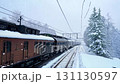 Winter train peaceful and tranquil journey that takes you through a stunning snowy landscape filled with majestic pine trees, creating a serene and picturesque atmosphere all around you 131130597