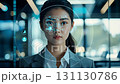 Woman scientist in hightech workspace that uses advanced technology and data visualization tools to boost productivity and collaboration among creative professionals and teams across various fields 131130786