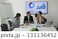 Team engaged in decision-making and communication during formal business meeting 131136452