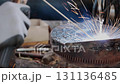 Track Shot Zoom Side View Construction Industrial Factory or Metalwork Concept by Mechanic or Technician Welder Welding Steel 131136485