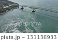 Aerial view of the Suo-Oshima Bridge from 140m above the ground, showing the complex tidal currents, taken by drone 131136933