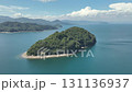 Aerial photography of a small uninhabited island, rotating from right to left along the edge of the island, drone aerial photography 131136937