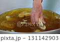 Deep fried bananas in hot oil. 131142903