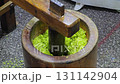 Tradition Thai dessert (Khao Mao), Green pounded unripe rice flakes. 131142904