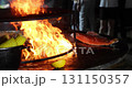 Large piece of red fish grilling at a street food festival 131150357