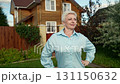 A Woman Standing at the Entrance of Her Home in a Beautiful and Picturesque Neighborhood 131150632