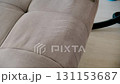 Hand of cleaning service worker removing dirt from sofa with vacuum cleaner. 131153687
