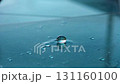Close Up of Blue Water Droplet Reflection on Smooth Surface Showcasing Beauty 131160100