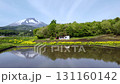 代搔き前の田んぼの水面に映る山 131160142