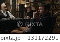 Three distinguished gentlemen playing poker game in a vintage old library 131172291