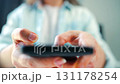 Woman scrolling through social media feeds on smartphone close up 131178254