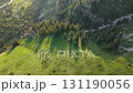 Majestic mountain valley illuminating under gentle sunlight 131190056