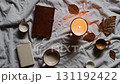 Cozy Autumn Still Life with Candle and Warm Drinks 131192422