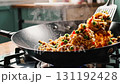 Fried Rice Cooking in Wok with Vegetables Stirred 131192428