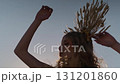 Young female model in autumn outfit posing against sunset background in mountains 131201860