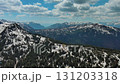 Rocky mountains in snow and green fir forest 131203318