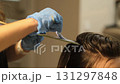 DIY hair highlights tutorial at home, offering easy techniques to create natural-looking blonde streaks. Perfect for a fresh and stylish look 131297848