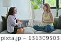 Young woman at therapy session with female psychologist, social worker 131309503