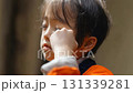 A boy wiping away tears while trying not to cry 131339281
