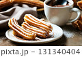 Freshly fried churros with plenty of jugar and sweet cocoa 131340404