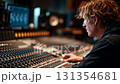 Sound engineer working on audio mixing console in recording studio 131354681