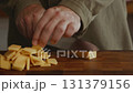 Calm chopping of cheese slices on board 131379156