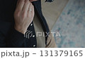 Close-up of male hand adjusting shirt for business look 131379165