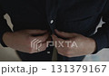 Close-up of hands fastening shirt button before office work 131379167