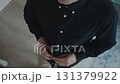 Top view of man buttoning shirt for professional appearance 131379922