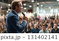 Mature adult male speaker in crowded business audience gives speech. Man is on commercial conference session. Lecture in exposition hall 131402141