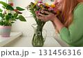 woman makes bouquet different autumn flowers 131456316