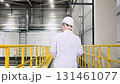 Industry engineer wearing uniform and hardhat in modern manufacture 131461077